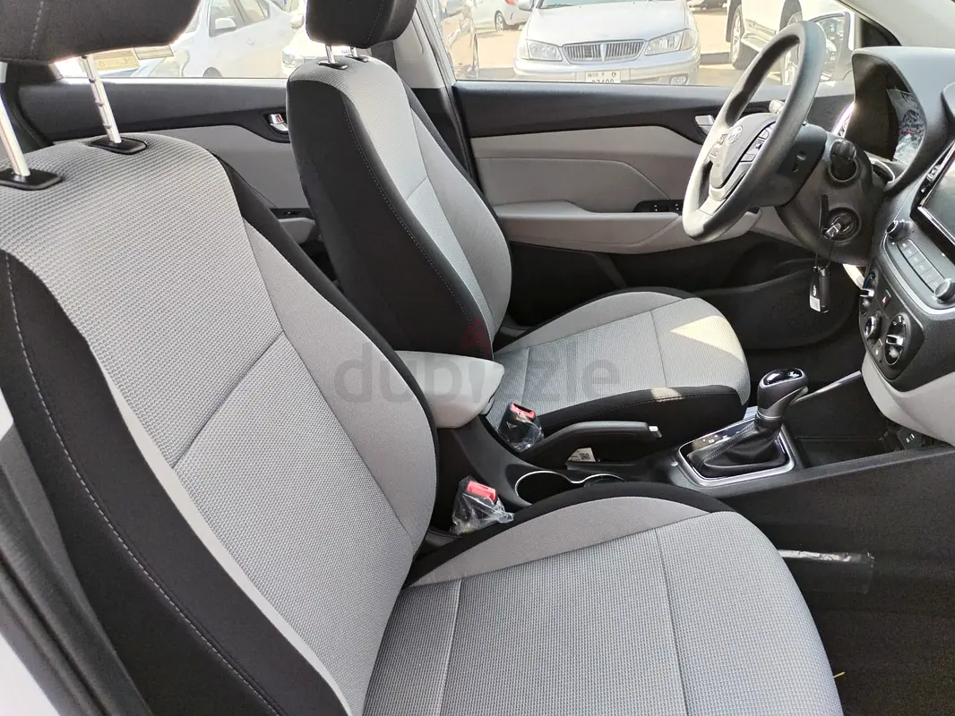 Rent a 2023 Hyundai Accent in International City photo 2