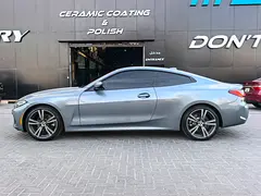 Rent a 2021 BMW 4-Series in Nad Al Sheba 3 photo 3