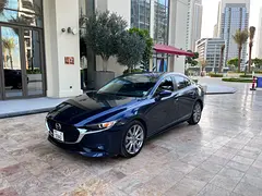 Rent a 2021 Mazda 3 in Nad Al Sheba 3 | Insured Self-Drive Rental rental in Nad Al Sheba 3, Dubai